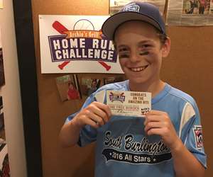 baseball player holding a special offer card