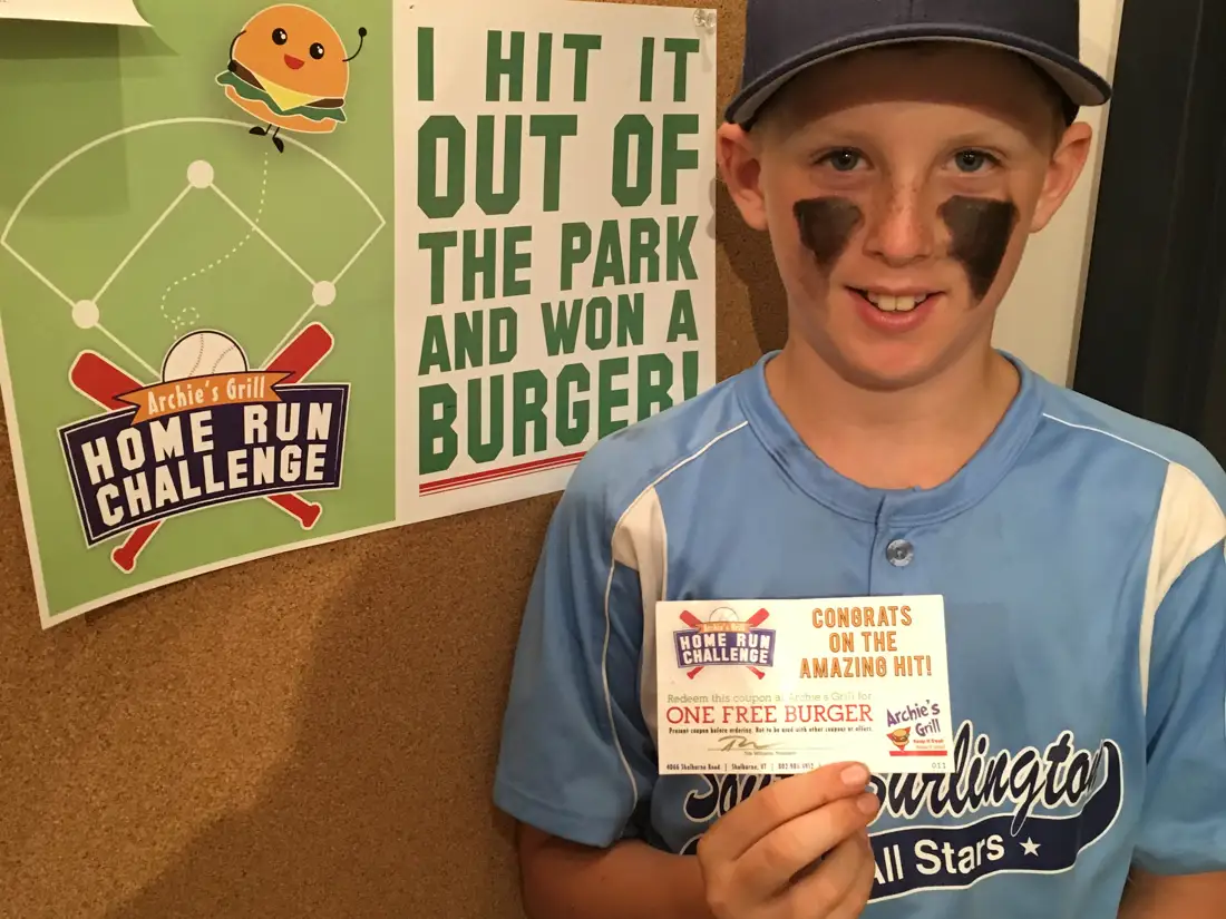 baseball player holding a special offer card